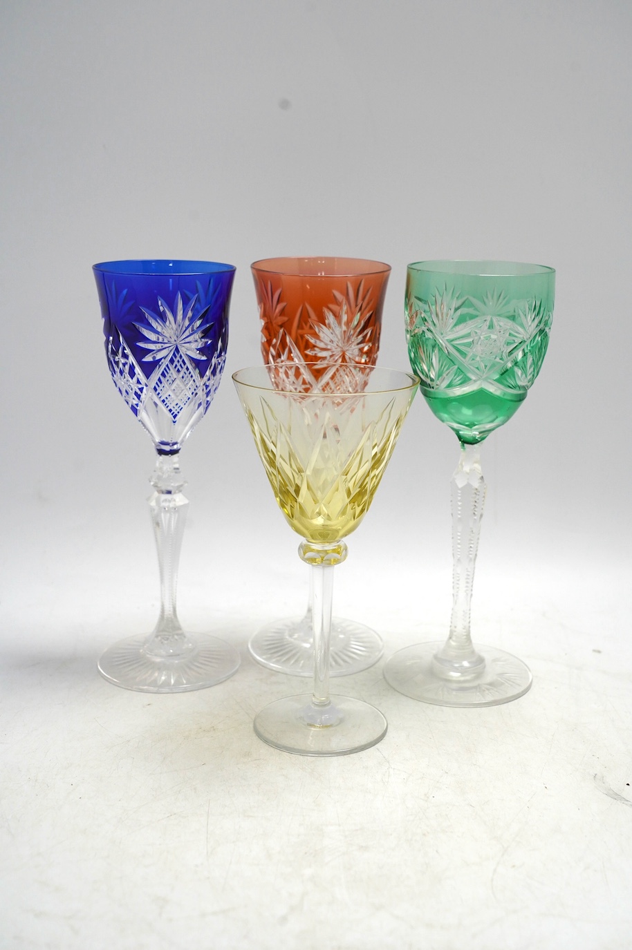Ten cut glass colour flashed wine glasses, tallest 21.5cm. Condition - good